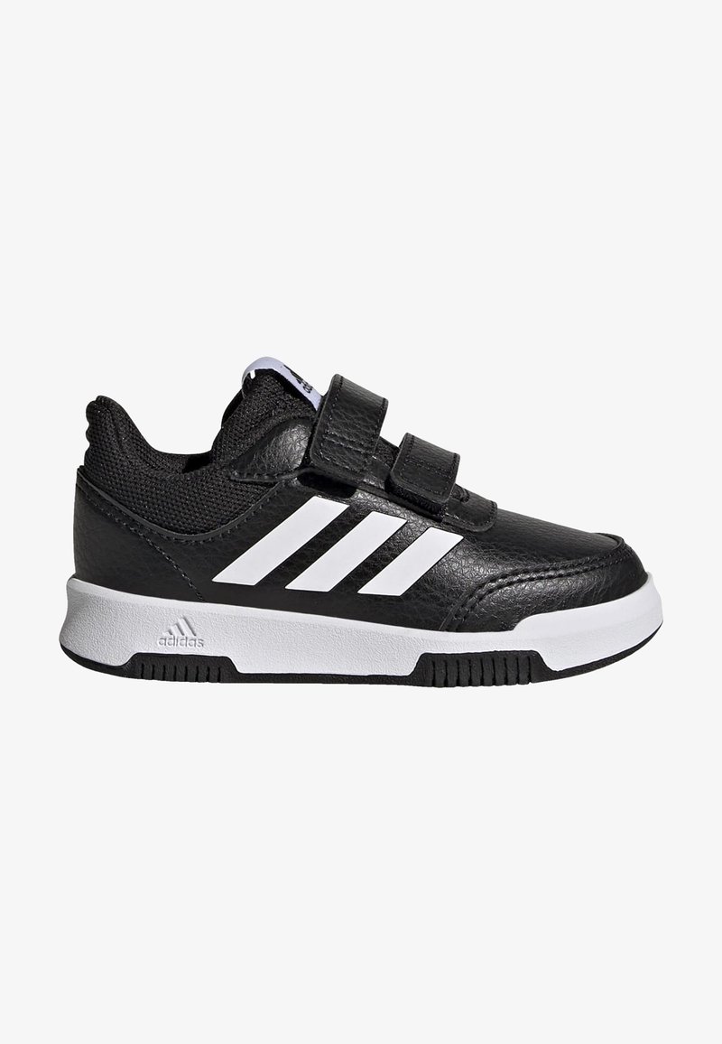 Sneaker nera con strisce bianche, realizzata in materiale sintetico testurizzato. Presenta un colletto imbottito, due strap in Velcro e una suola in gomma.