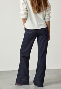 Next GOLD BUTTON FRONT WIDE  - Wide leg - denim rinse