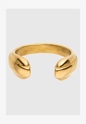 Kuldtooniga metallist käevõru sõrmus, millel on sile ja kaarjas disain. Sõrmusel on kaks ümarat otsa, mis näitavad läikivat viimistlust ja sujuvat tekstuuri.