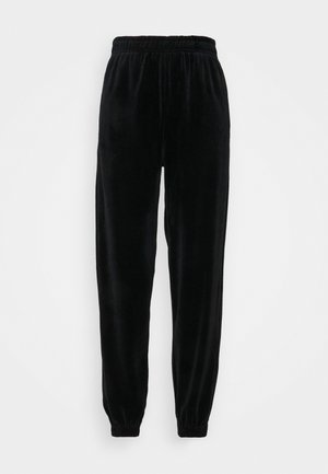 Pantalon de jogging en velours noir avec une taille élastique, des poignets de jambe fuselés et une texture douce et lisse. Sans poches ni éléments métalliques visibles.