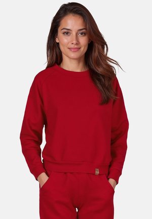 Rode katoenen sweatshirt met een ronde halslijn, raglan mouwen en ribgebreide zoom. Heeft zijzakken en een klein merketiket op de tailleband.