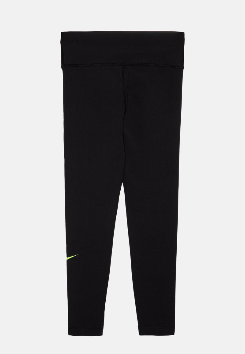 Legging noirs en tissu extensible, avec une taille haute et un petit logo en forme de virgule vert fluo près de la cheville gauche.