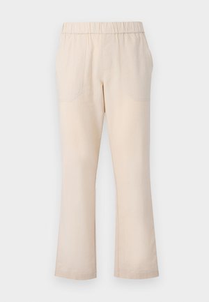 Beige flared trousers featuring an elastic waistband, two front pockets, and a smooth cotton texture. No visible patterns or hardware.
