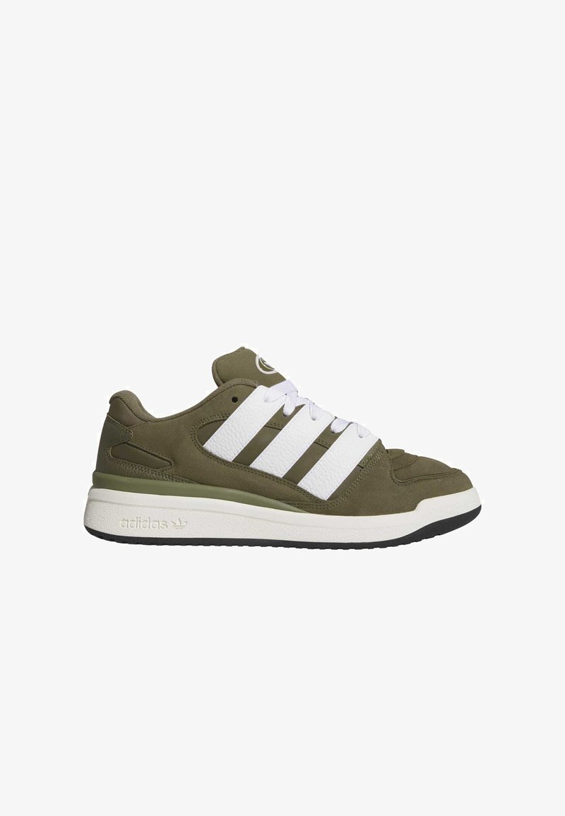 Green suede sneakers with white leather stripes and laces. Features a textured tongue and rubber sole with black bottom. Brand logo on side.