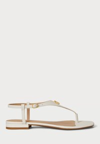 Płaskie klapki z off-white skóry z designem T-strap. Posiadają okrąły nosek, minimalistyczną klamrę i niski obcas. Teksturowane wykończenie.