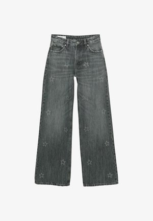 Tummanharmaat leveät farkut, joissa on edessä ja taskuissa hajautettuja tikattuja tähkäkuvioita, esitelty valkoisella taustalla.