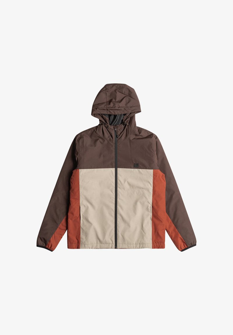 Hoodiejacka med bruna, krämfärgade och rostfärgade paneler; tillverkad av lätt material med blixtlås framtill och elastiska ärmslut.