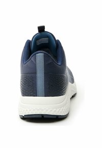 Navy blue athletic shoe with textured mesh upper and contrasting light blue accent. Pull tab at heel, cushioned white midsole, rubber outsole.