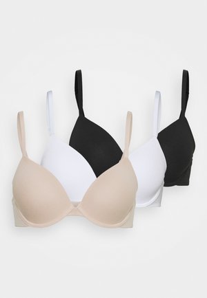 Drei BHs in Nude, Weiß und Schwarz. Jeder hat ein glattes, gepolstertes Design mit verstellbaren Trägern und einer nahtlosen Verarbeitung.