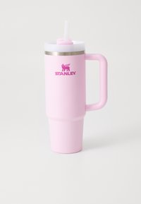 Pink insulated tumbler with a handle, straw, and silver band. Features a matte finish and the "STANLEY" logo in bright pink.