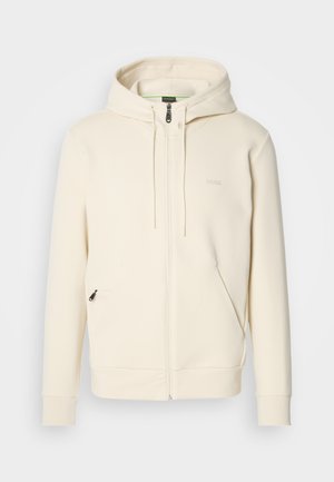 Crème kleurige zip-up hoodie met trekkoorden, geribde manchetten, twee voorzakken met rits en een subtiele "BOSS" logo op de borst.