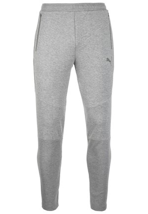 Vaaleanharmaat kapenevat collegehousut, joissa on vetoketjulliset sivutaskut ja Puma-logo vasemmassa reidessä, valmistettu pehmeästä kankaasta.