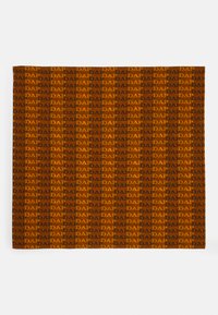 Brown textile featuring a repeating pattern of the word "DAP" in orange and black, with a smooth texture and rectangular shape.