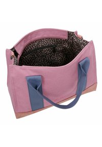 Borsa tote in tela rosa con manici blu, caratterizzata da un interno nero a motivo e una tasca con zip. Base solida per stabilità.