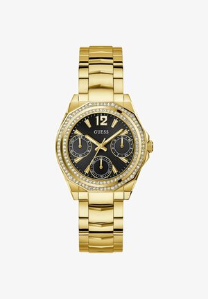 Arany fém karkötőóra nyolcszögletű tokban, fekete számlappal, kristály díszítésekkel és három segédszámlappal. A karkötő fényes, textúrázott felülettel rendelkezik.