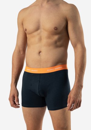 Zwarte boxershorts met een oranje tailleband met de tekst "HAPPY SHORTS". Gemaakt van een zachte, rekbare stof voor comfort.