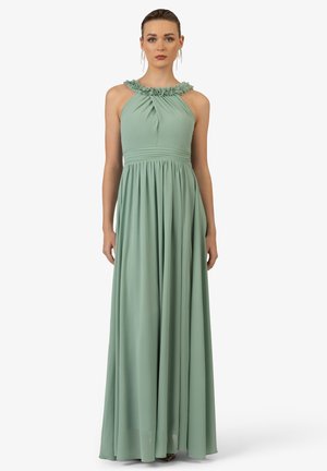 Long, mint green dress with a ruffled neckline and empire waist, made from flowing fabric, featuring a pleated skirt and sleeveless design.