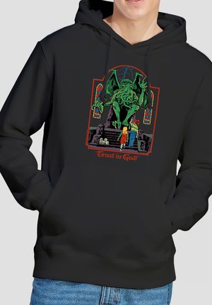 Black hoodie featuring a green winged monster with tentacles confronting two children on stairs, with stained glass windows and "Trust in God!" text.