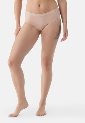 Beige hipster underwear with a smooth texture and wide waistband, featuring mid-rise coverage and a minimalist design.