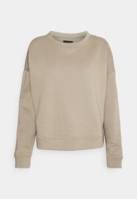 Sweatshirt beige avec un col rond, des épaules tombantes et des poignets côtelés. Texture douce, coupe décontractée et détails de couture minimaux.
