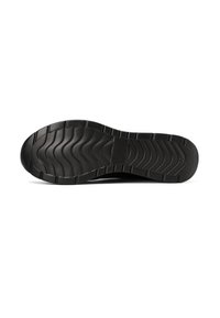 Suola di scarpa in gomma nera con un motivo a ondulazione per una migliore aderenza, texture liscia e un'impronta centrale con logo circolare.