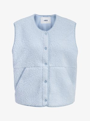 Light blue sleeveless fleece vest with front snap buttons, side pockets, and a rounded neckline, labeled JJXX.
