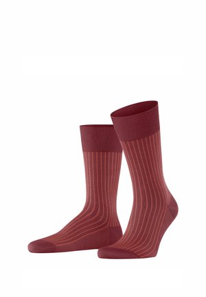 Bordeauxrote gestreifte Socken mit einem gerippten Bündchen, aus weichem Material. Sie haben vertikale Streifen in einem etwas dunkleren Farbton.