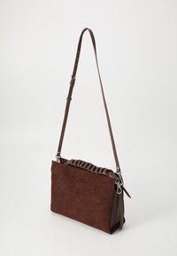Brown suede clutch bag with a textured ruffled top edge, single adjustable strap, and silver hardware accents. Rectangular shape.