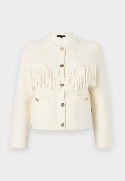 White knitted cardigan with textured fringe detail, round neckline, five buttons, and two front pockets featuring decorative stitching.