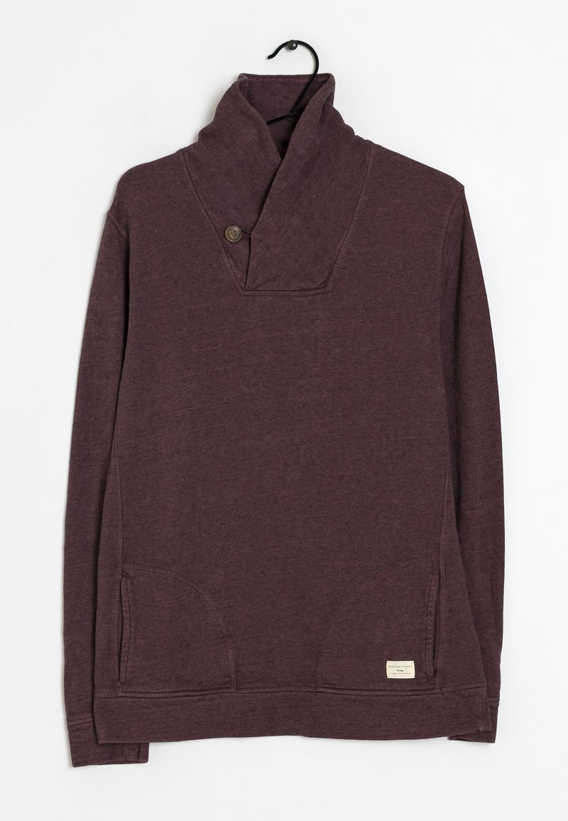 Bordeauxfärgad tröja med krage, iögonfallande med en knapp, framfickor och en etikett på fållen. Mjuk, strukturerad tyg.