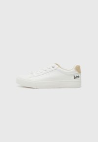 White leather sneaker with textured rubber sole, round toe, and lace-up front. Features a beige suede heel tab and embroidered "Lee" logo.