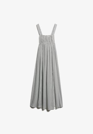 Długa, bezrękawna sukienka w czarno-białe paski z kwadratowym dekoltem, marszczoną górą i zwiewnym, plisowanym dołem z wzorem w kropki.