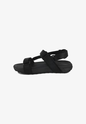 Schwarze Sandalen mit mehreren verstellbaren Riemen, einer strukturierten Sohle und einem gepolsterten Fußbett. Leichtes Design, geeignet für den Außeneinsatz.