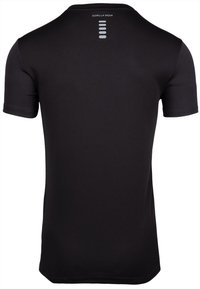 Zwart sportshirt met korte mouwen en een getailleerd ontwerp, gemaakt van een structuurstof. Bevat een reflecterende logo en horizontale lijnen op de rug.