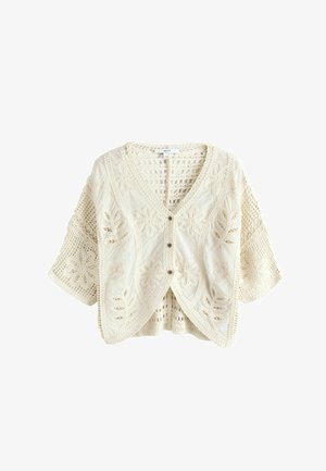 Kremfarvet hækle strikket cardigan med blomsterprint, korte vide ærmer og tre knapper foran.