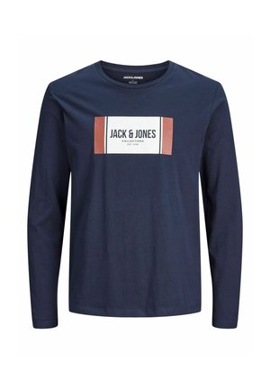 Long-sleeve navy t-shirt in soft cotton features a rectangular white label with "JACK & JONES" and a rust-colored accent. Simple design.