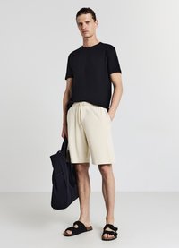 Calliope GINNICO - Pantaloni sportivi - beige chiaro