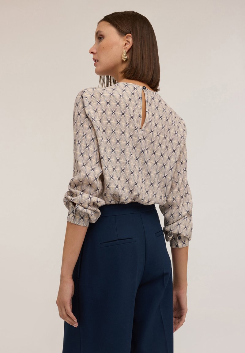 Camicetta da donna elegante in mussola, con scollo a V, camicia estiva