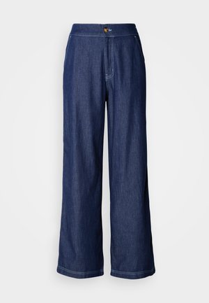Wide-leg denim pants in dark blue with a button waist closure, contrasting stitching, and a smooth texture. Tailored for a relaxed fit.