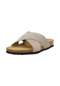 Beige suede slide sandals with crossover straps, cork insole, and a black rubber sole. Flat design with open toe and minimal detailing.