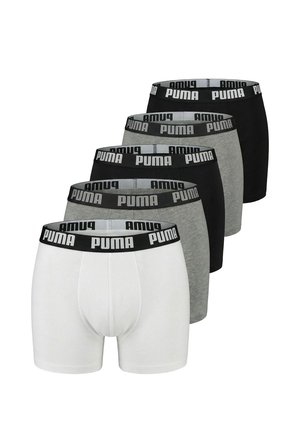 Five pairs of Puma boxer briefs in black, grey, and white, stacked diagonally with visible elastic waistbands branded "Puma."
