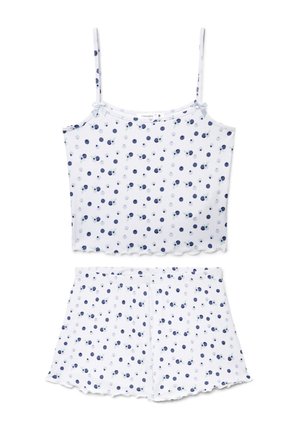 Set pigiama con canotta bianca a coste e pantaloncini, con pois blu e grigi e piccoli dettagli a fiocco sulle spalline.