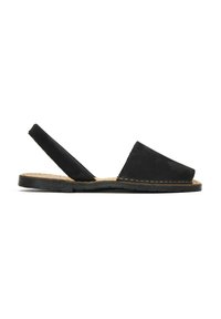 Black suede slingback sandal with a flat sole, open toe, and vertical strap design. Subtle stitching detail around the edge.