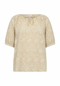 Blusa beige con scollatura tonda, maniche corte a palloncino e ricami floreali bianchi e motivi a intaglio su tutta la stoffa.
