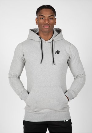Grijze hoodie van een katoenmix, met een kenguruzak, zwarte trekkoorden en een klein zwart gorillalog op de borst.