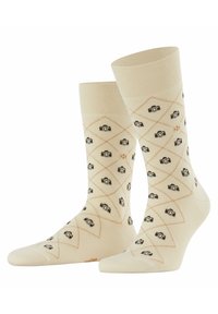 Cremfarbene Socken mit einem Diamantmuster und Kamera-Graphics in Schwarz und Beige. Weiches, Baumwollmischgewebe mit gerippten Bündchen.