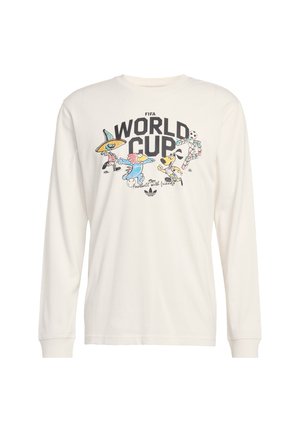 Λευκό πουκάμισο με μακριά μανίκια, με κείμενο FIFA World Cup και καρτουνίστικες μασκότ που παίζουν ποδόσφαιρο με πολύχρωμες στολές μπροστά.
