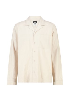 Beige overhemd met lange mouwen, knopen, borstzak en een spreadkraag, label met de tekst "America Today."