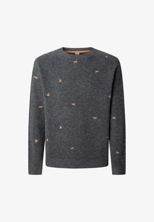 Tamsiai pilka vilnos megztinis su apykakle, su mažais oranžiniais siuvinėjimais visame megztinyje. Riboja rankogaliai ir apačia.