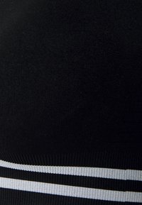 Smilodox SEAMLESS STRIPE SPORTS BRA  - Sutiã desportivo de suporte ligeiro - schwarz